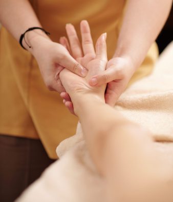 close up image beautician massaging hands female client restore balance body decrease anxiety scaled e1729564736723